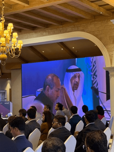 Roundtable audience watching the proceedings on a large screen