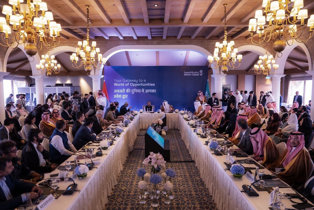 Wide view of delegates seated around the India–Saudi roundtable