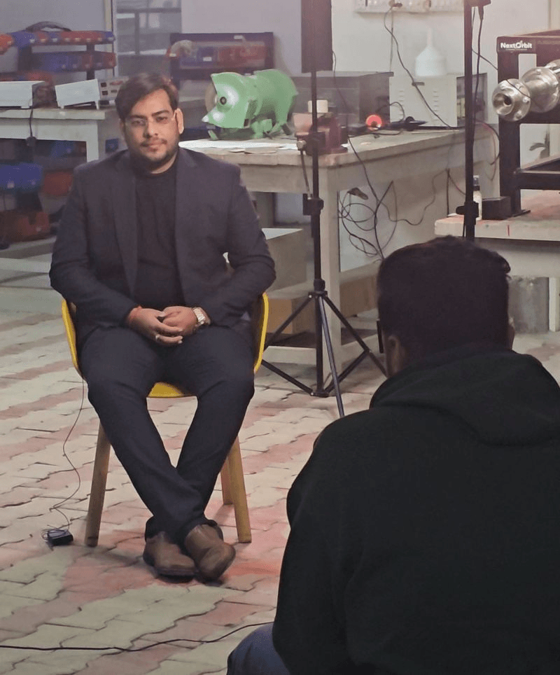 Interview participant seated during filming at a workshop
