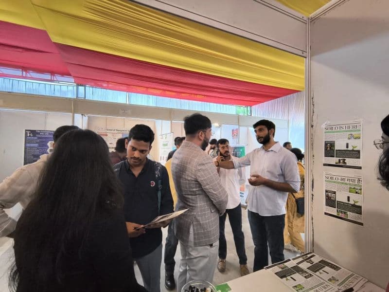 Visitors discussing an exhibit with Soilo at Bharat Innovation Conclave