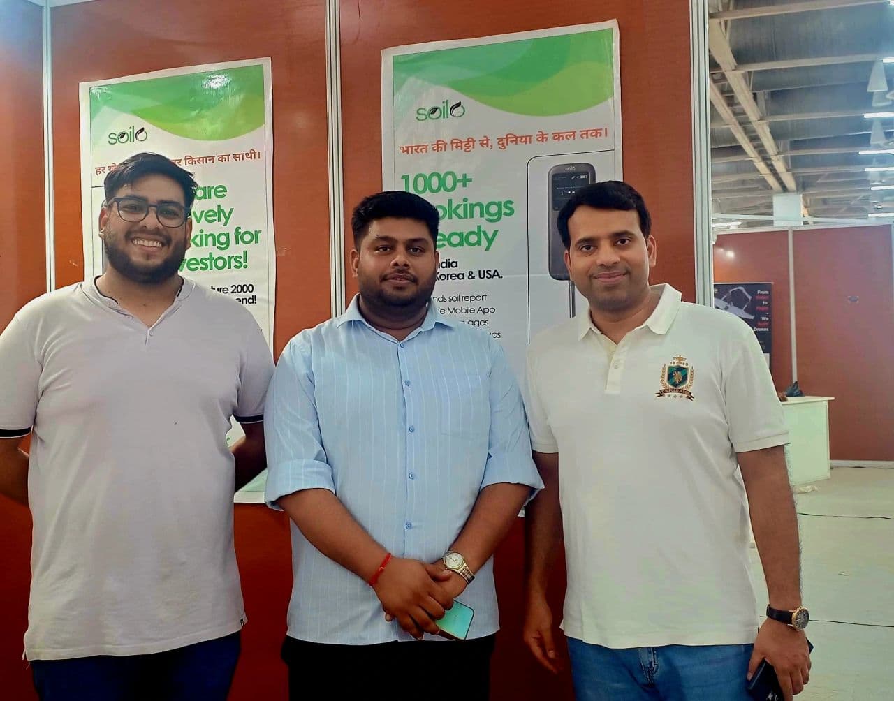 Visitors and Soilo representatives beside the UPITS 2025 display
